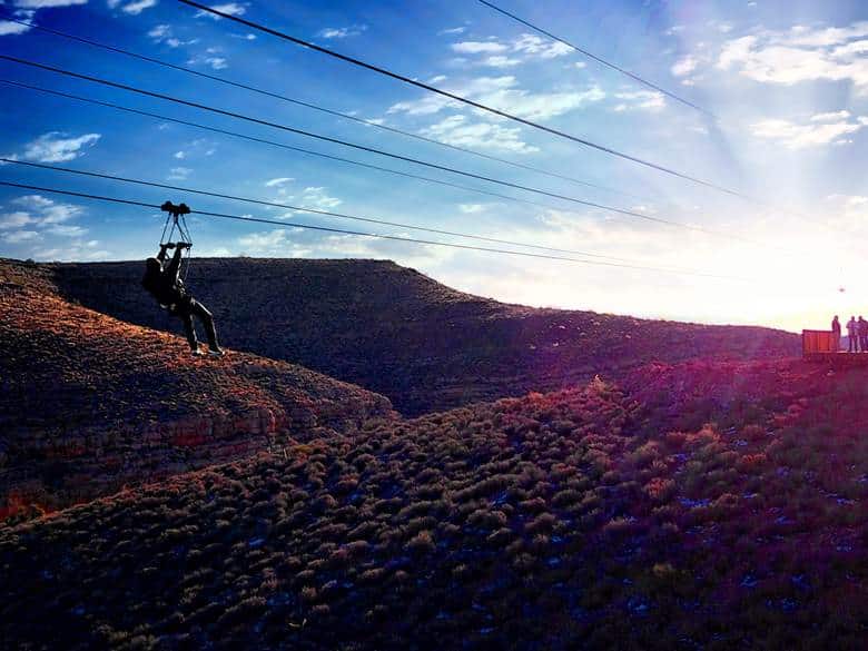 A person riding the zipline at Grand Canyon West.