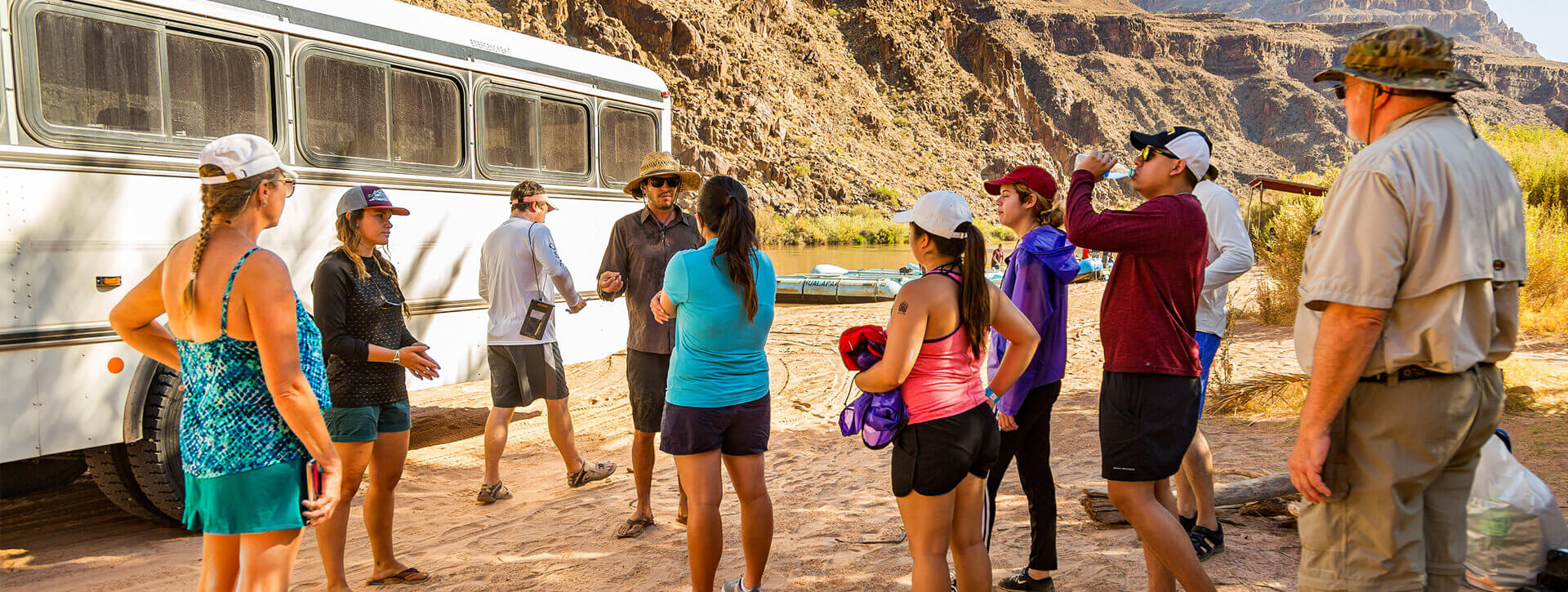 A group of people prepare to go rafting on the Colorado River